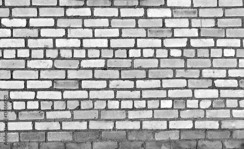 Old black and white brick wall texture.