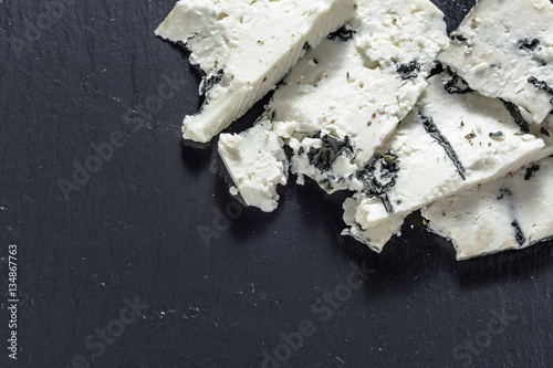 Blue cheese on black back board, french cuisine appetizer. photo