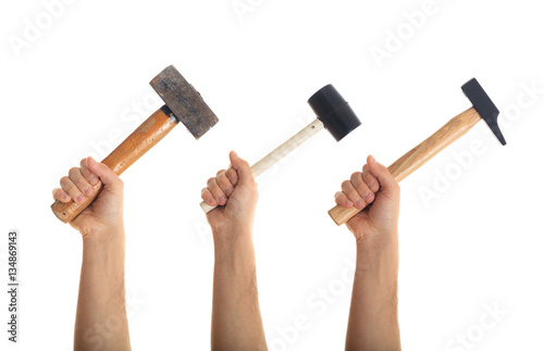 Fototapeta Hands holding hammers on white background