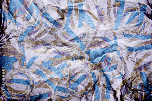 Crumpled fabric grungy abstract background in pastel blue, purpl