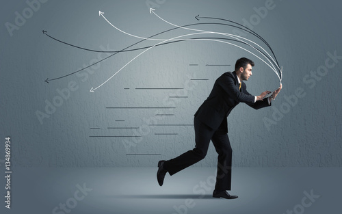 Running businessman with device and hand drawn lines © ra2 studio