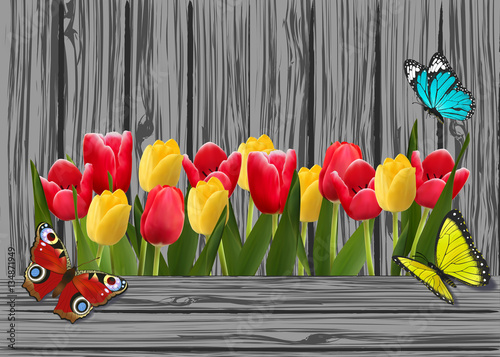tulips on old grey wooden boards