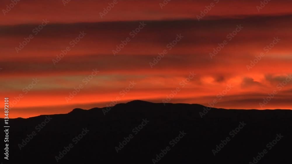 Fiery Sunset Clouds over Mountain Fiery Sunset Clouds over Mountain