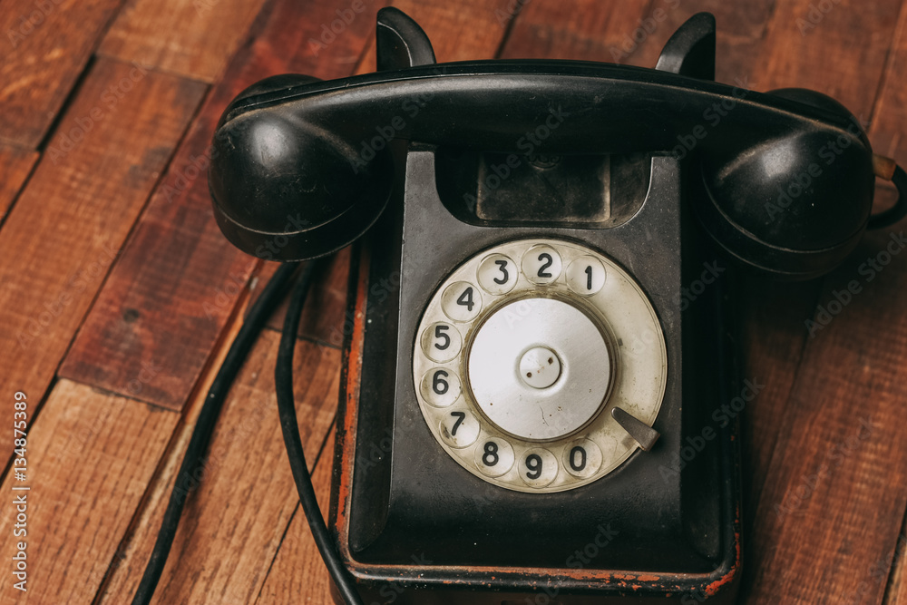 old telephone with wire on a wooden background, retro old telephone with wire on a wooden background, retro
