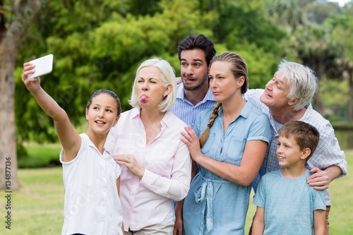Multi-generation family taking a selfie on a mobile phone