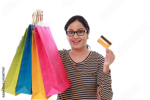 Happy young woman with shopping cards and debit card-Cashless pu photo
