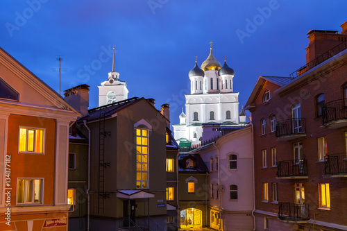 Pskov Kremlin fortress on the background of new quarter. Written Russian - Gold Embankment - name of quarter