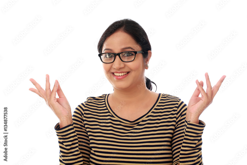 Excited young indian woman against white background Excited young indian woman against white background