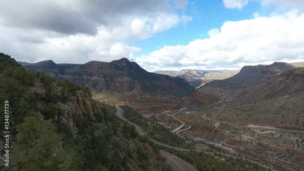 Aerial of road switchbacks in a scenic canyon Aerial of road switchbacks in a scenic canyon