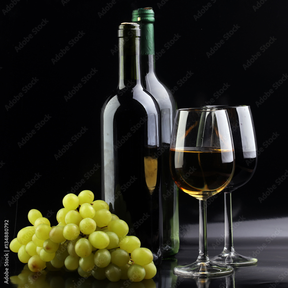 Wine glass and Bottle on black background. Red and white wine