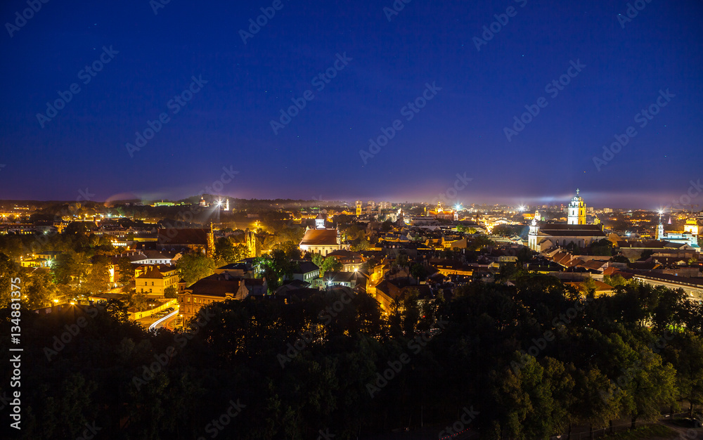 Vilnius city night aerial view - Lithuanian capital by bird eye