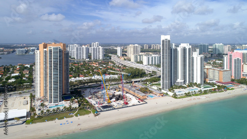 Aerial drone image of a beachfront construction site in Sunny Isles Beach FL, USA © Felix Mizioznikov