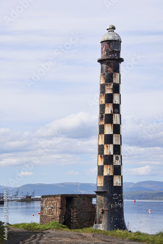 The derelict West Quay Lighthouse, off Mirren Shore at Port Glasgow, on the banks of the Firth of Clyde.  photo