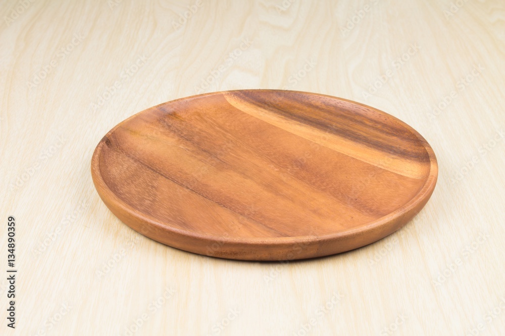 empty wood plate on wood table background / can be used display your product empty wood plate on wood table background / can be used display your product