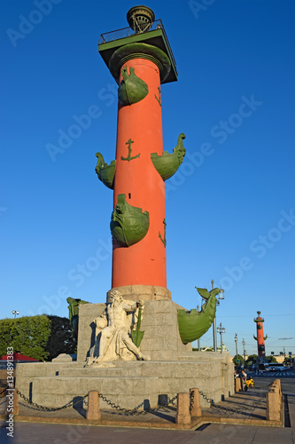 Rostral columns on the spit of Vasilyevsky island in St. Petersb photo