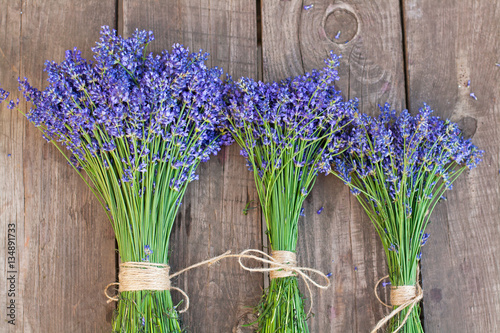 Bouquets of lavender on vintage wood background