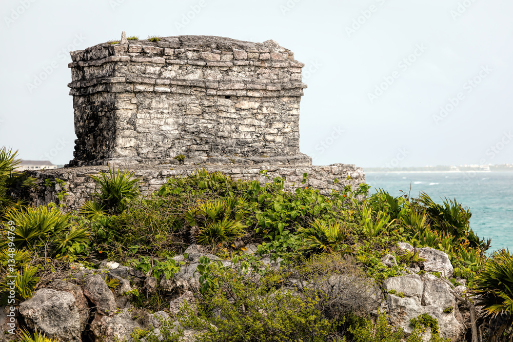 The ancient Mayan God of Winds Temple, guarding Tulum's sea entrance bay in Quintana Roo, Mexico