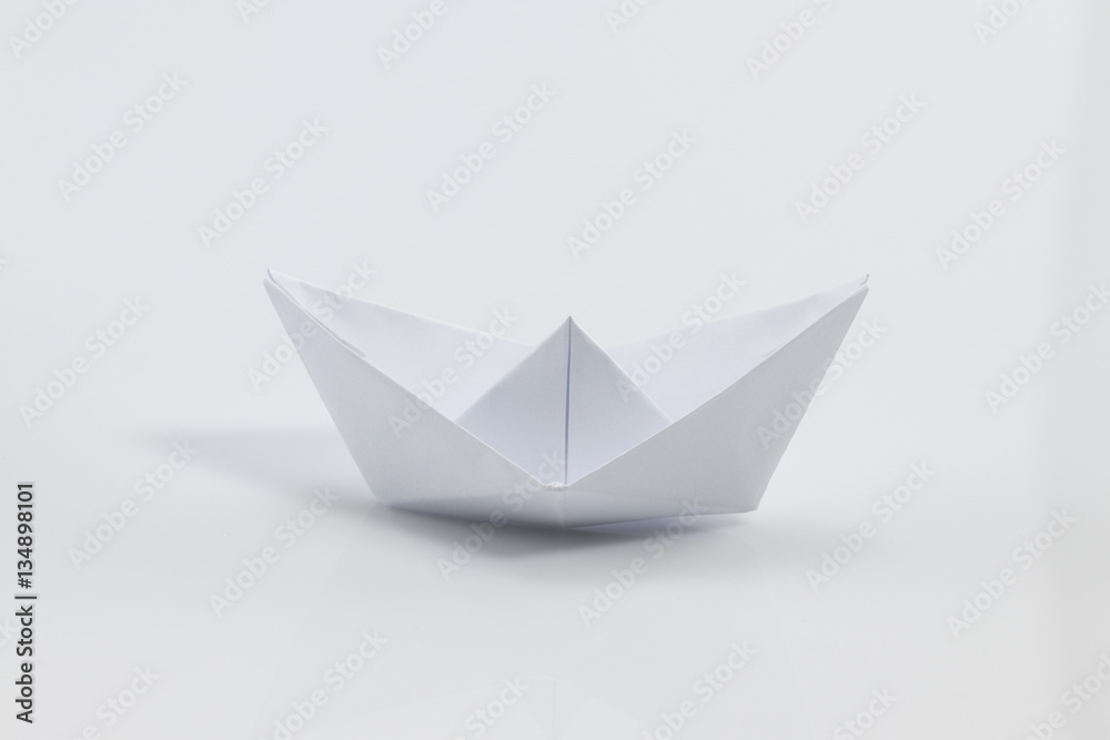Close up origami ship isolated on white background Close up origami ship isolated on white background