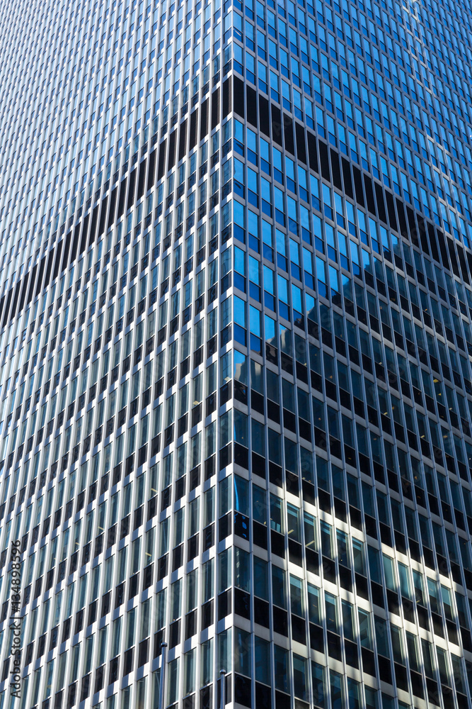 Closeup of glass and concret building.