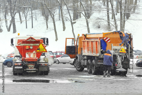 Snow plow trucks outdoors after cleaning street