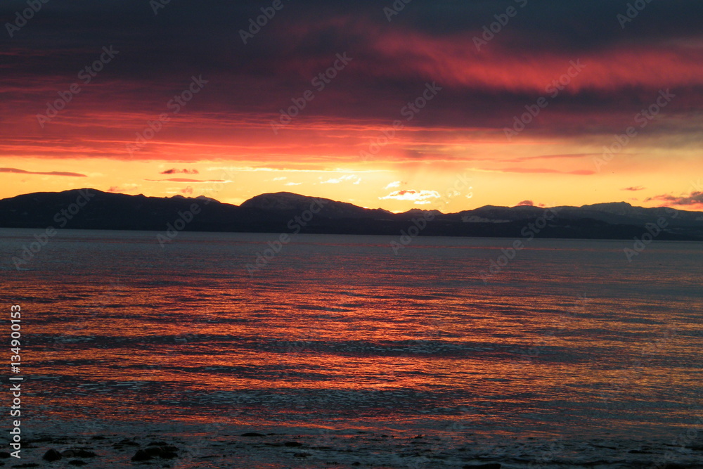 Sunset on the Ocean with Mountains