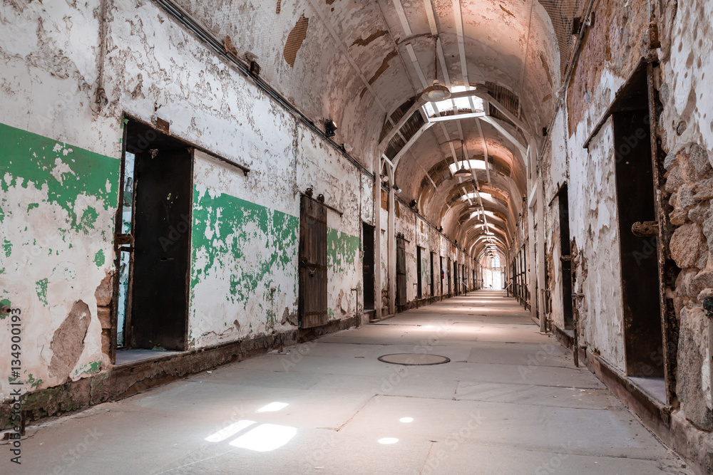Jail hallway with locked doors.