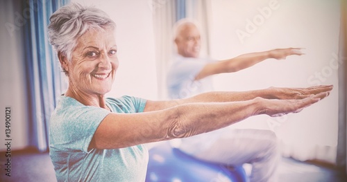 Seniors using exercise ball