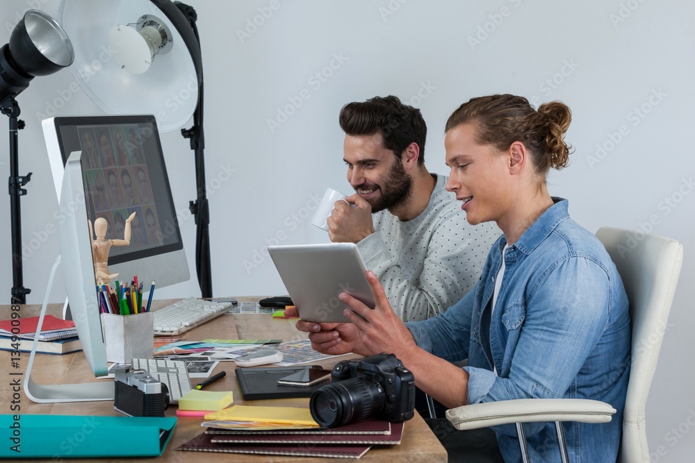 Photographers working together at the desk Photographers working together at the desk