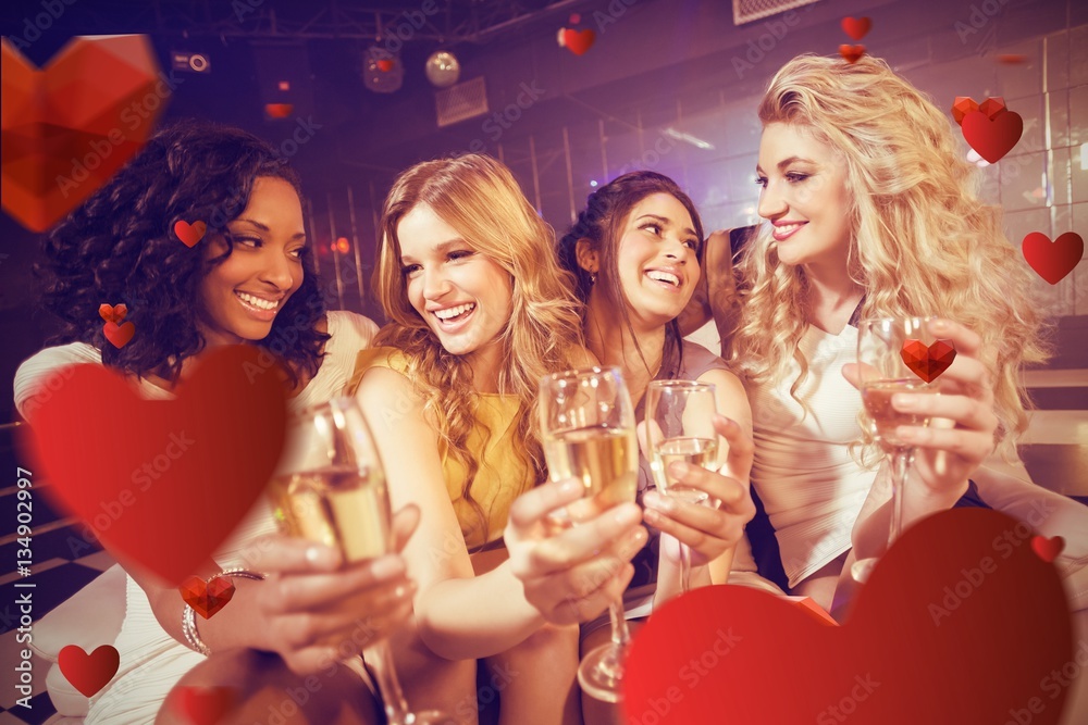 Composite image of pretty girls holding champagne glass