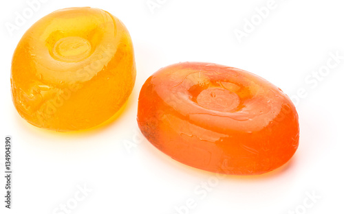 Two colorful fruit hard sugar candies,  boiled sweeties or sugar