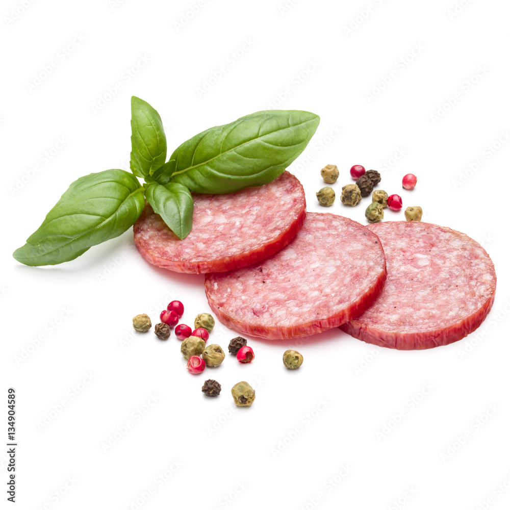 Salami smoked sausage three slices, basil leaves and peppercorns Salami smoked sausage three slices, basil leaves and peppercorns