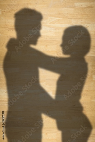 Composite image of young couple looking face to face