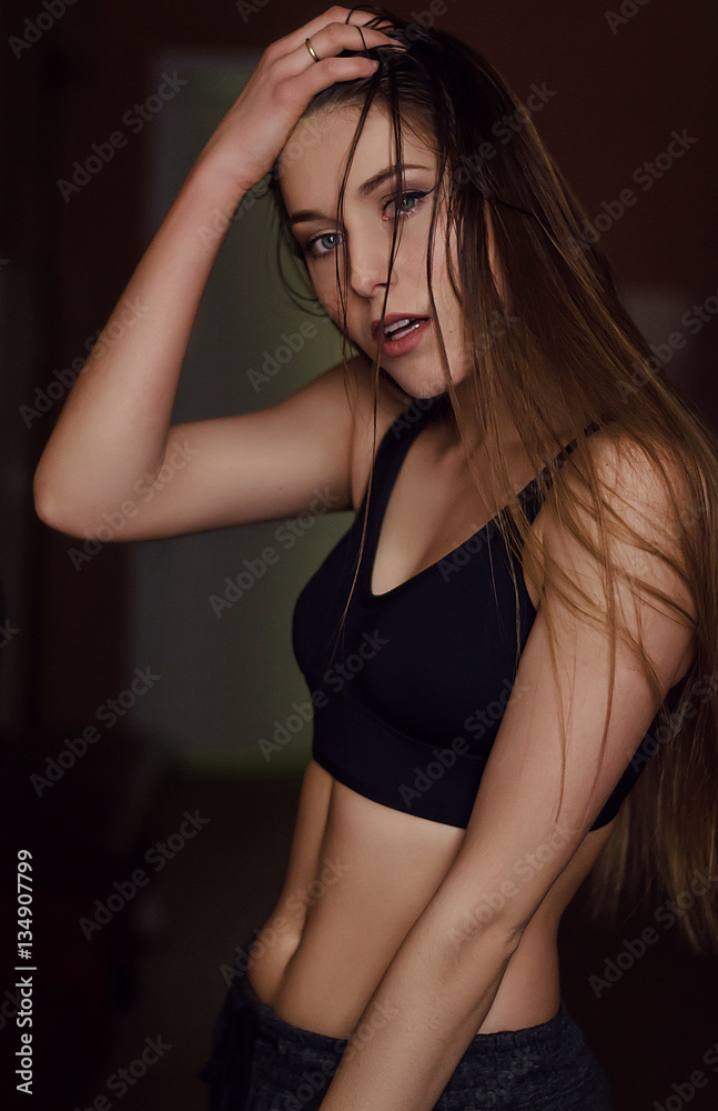 Portrait of young woman with long hair after the workout with wet hair Portrait of young woman with long hair after the workout with wet hair