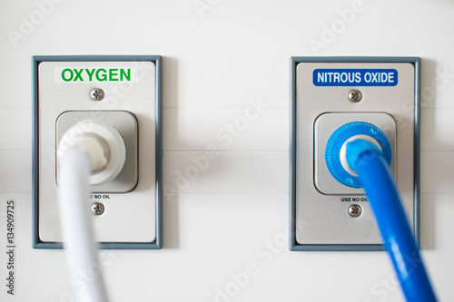 Maternity drugs gas and air wall plug equipment machine mixing dose of oxygen and nitrous oxide making entonox used for pain relief in labour with antibacterial filter pressure hose tube in hospital
