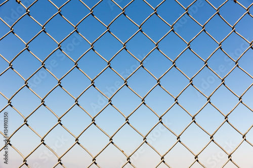 Fence rabitz closeup on blue sky background