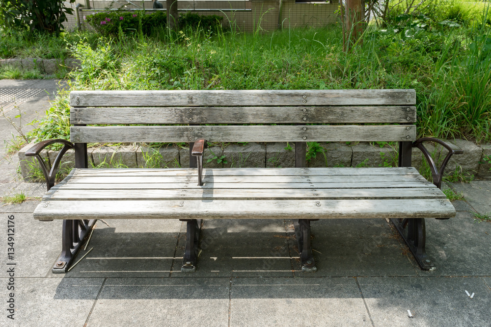 Outdoor wooden bench in a park from Japan Outdoor wooden bench in a park from Japan