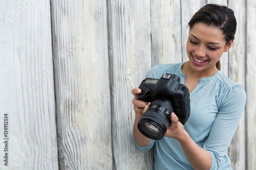 Photography Female photographer reviewing captured photos