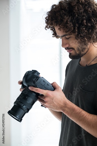 Photography Male photographer reviewing captured photos