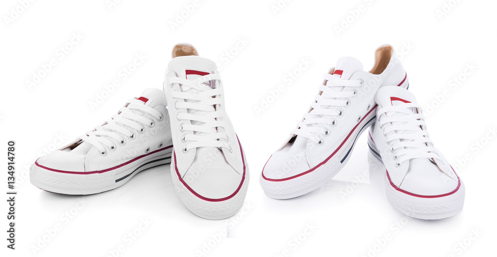 Classic white sneakers isolated on white background - obrazy, fototapety, plakaty 