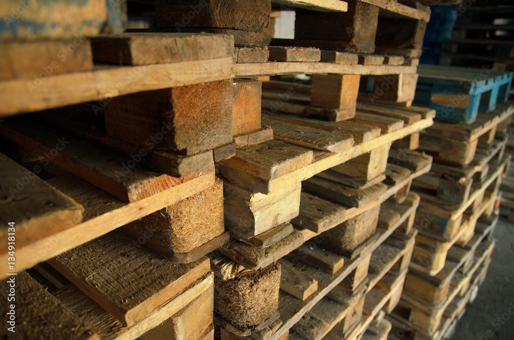 .wooden pallets. wood texture. Pallets stacked in piles. .wooden pallets. wood texture. Pallets stacked in piles.