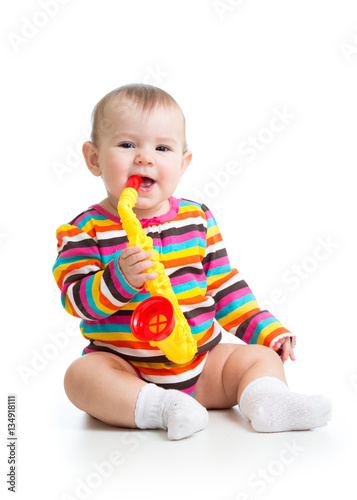 Funny baby girl playing wit...