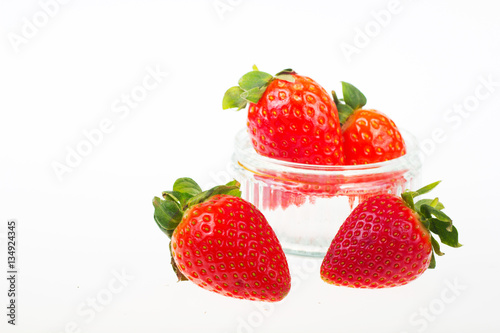 Fototapeta Naklejka Na Ścianę i Meble -  Bright red strawberries against a white background