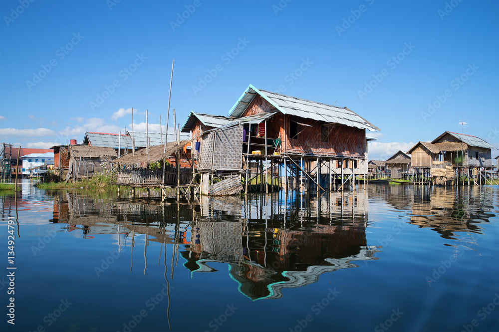 Traditional houses on stilts in fishing village on the Inle lake. Myanmar Traditional houses on stilts in fishing village on the Inle lake. Myanmar