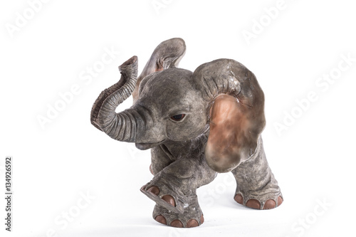 stone sculpture of an African elephant isolated on white background