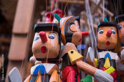 Wooden pinocchio dolls with...