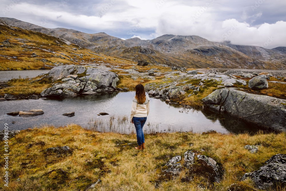 Tourist girl enjoying view and nature in Norway Tourist girl enjoying view and nature in Norway