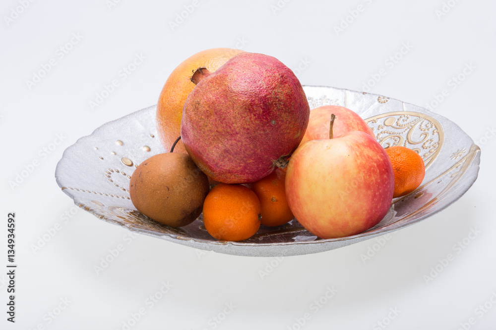 mix fresh fruits on plate isolated on white mix fresh fruits on plate isolated on white
