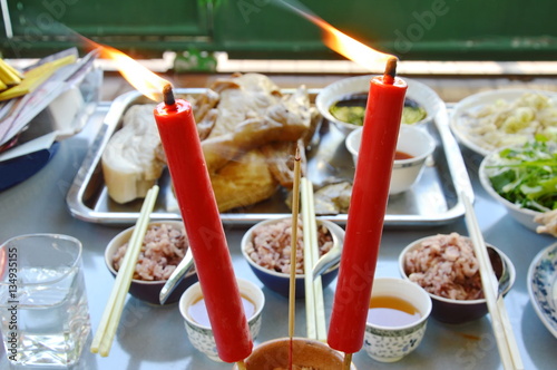 Φωτογραφία incense stick fire and food course for offering god with ancestor in Chinese tra