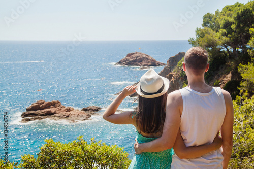 Tablou canvas Young couple enjoying the view of the Costa Brava coast and the sea at the Tossa
