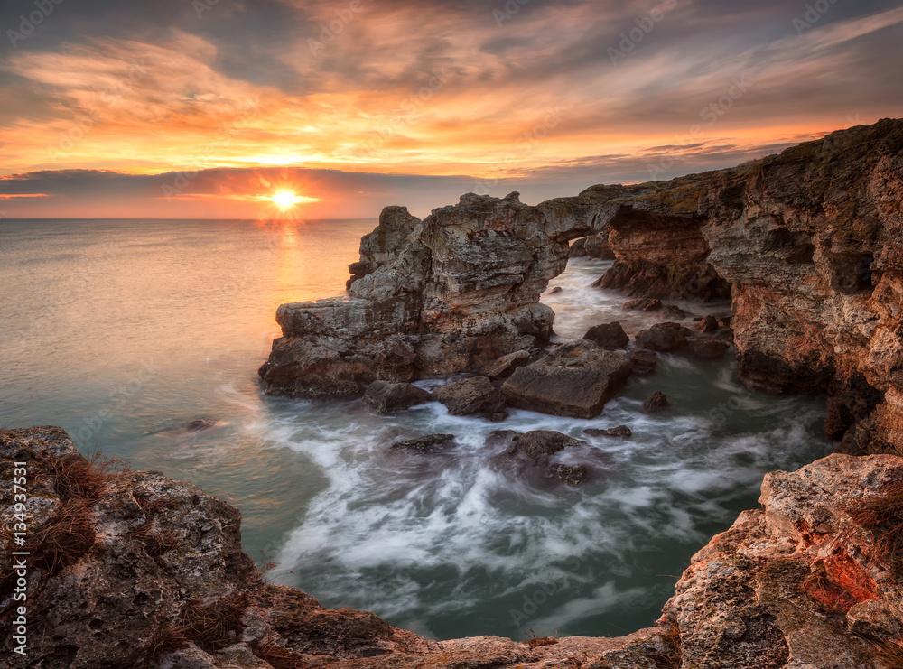 Sea rocks and winter sea /
Long exposure winter seascape at sunrise with rock formation 